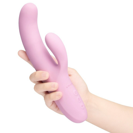 Pink silicone le wand vibrator  product held in a hand against a white background