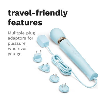 Light blue electronic device with multiple plug adaptors on a white background, labeled 'travel-friendly features'.