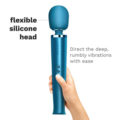 Blue handheld electronic device with a flexible silicone head, held by a hand on a white background.