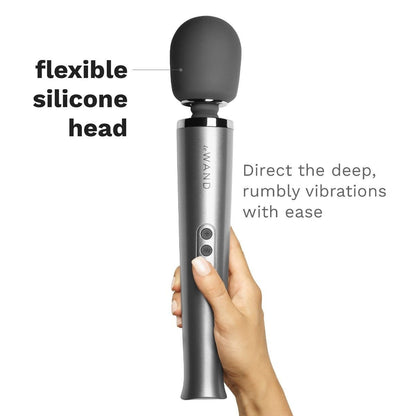 Silver Wand massager with flexible silicone head held by a hand on a white background