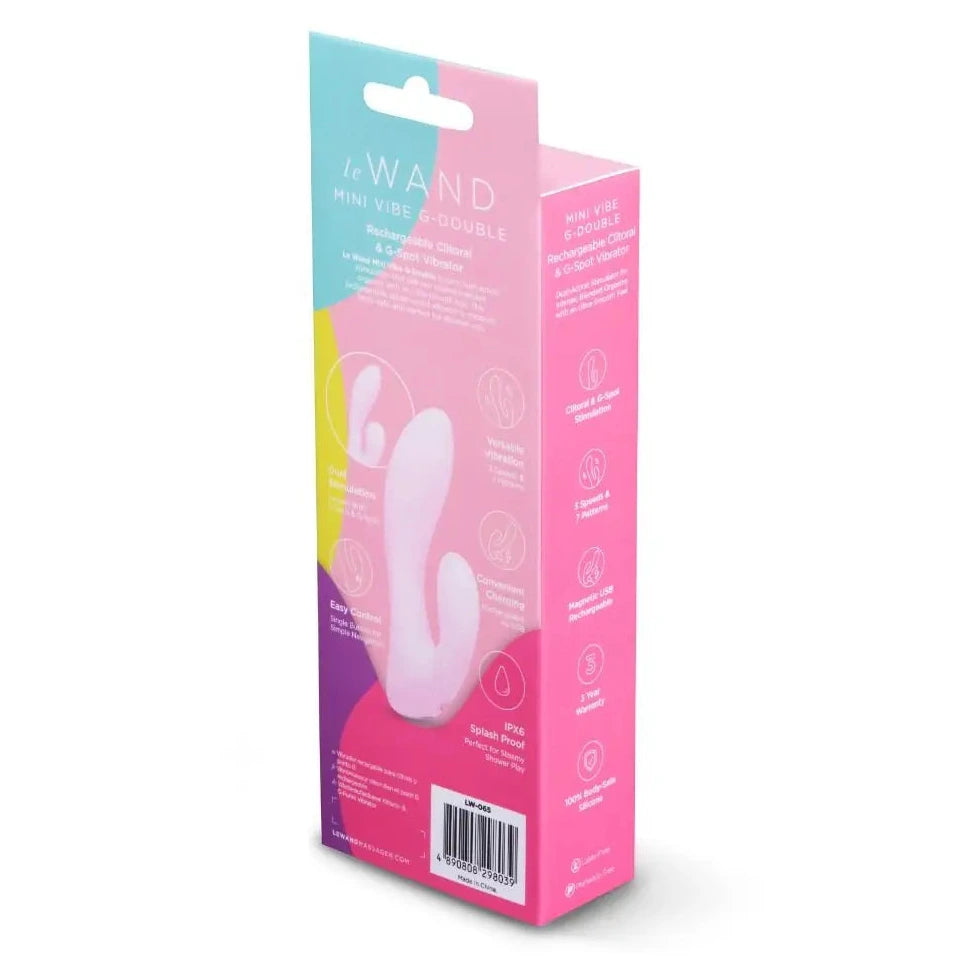 Pink packaging of a 'Le WAND' product on a white background