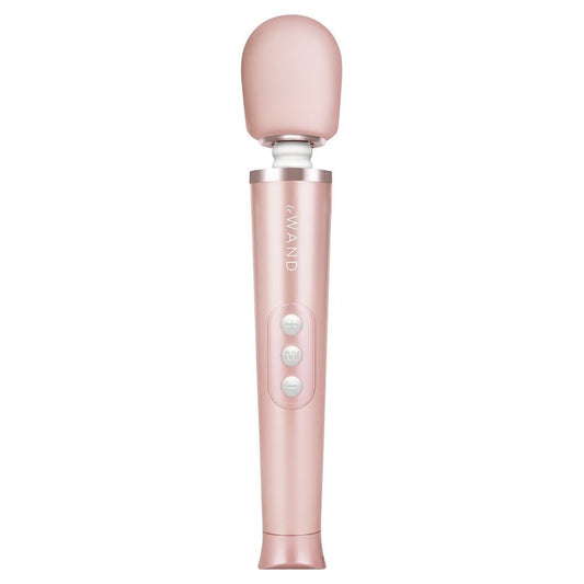 Pink handheld device with 'Le WAND' branding on a white background