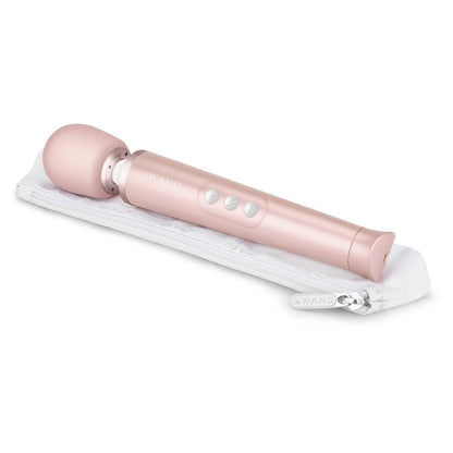 Pink handheld massager on a white background
