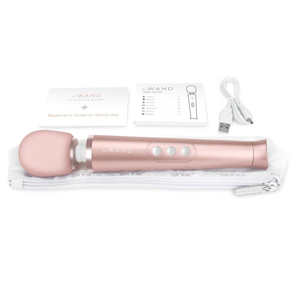 Rose gold G-Wand with packaging and USB cable on a white background