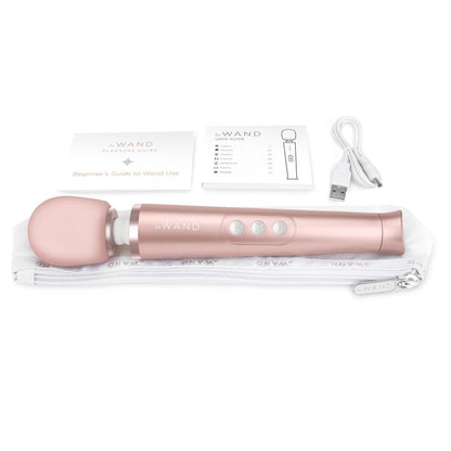 Rose gold G-Wand with packaging and USB cable on a white background