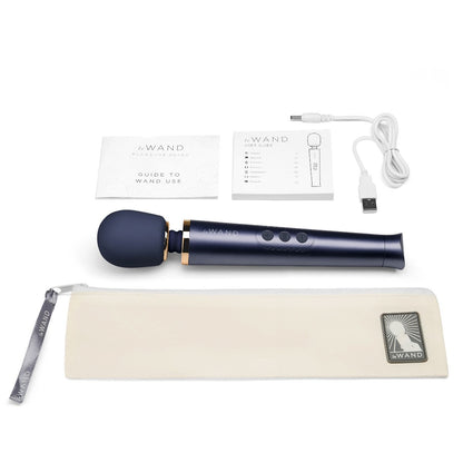 Black handheld massage device with accessories on a white background
