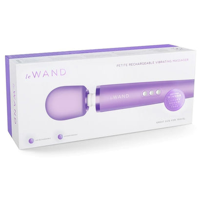 Purple 'Le Wand' petite rechargeable vibrating massager in packaging on a white background