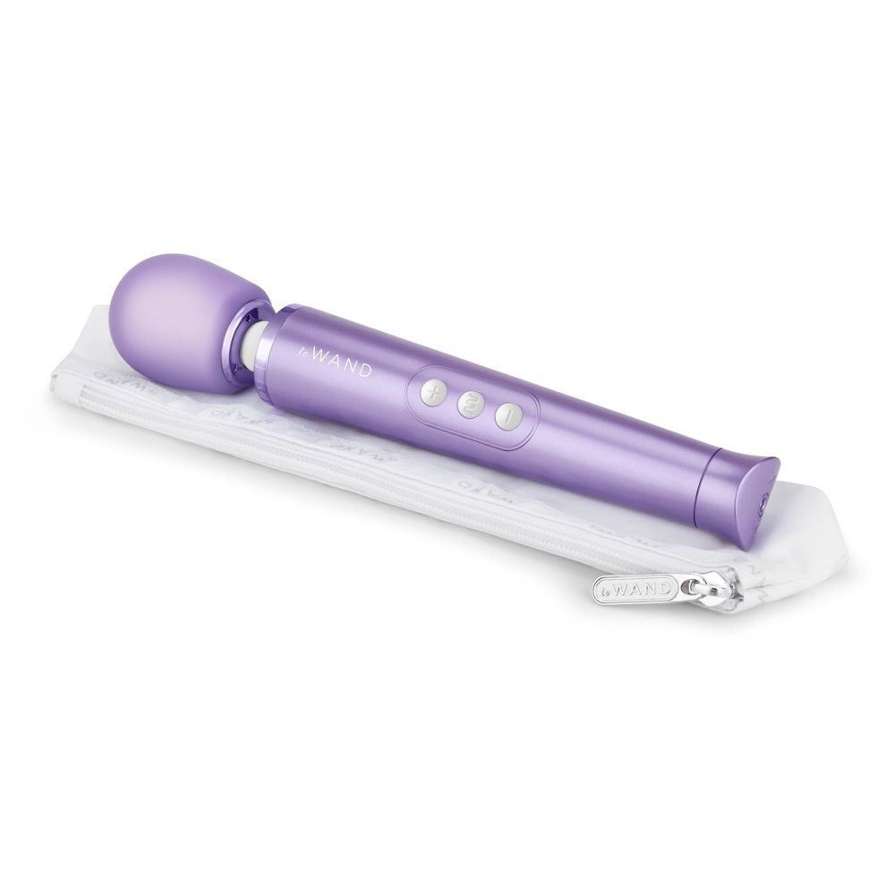 Purple handheld device with 'Le WAND' branding on a white background
