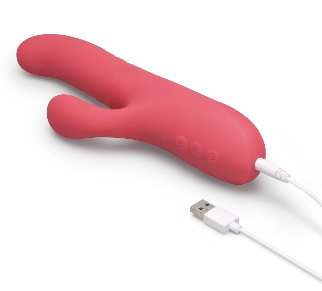 Red electronic device with USB cable on a white background