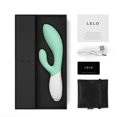 Mint green and white electronic device with LELO branding, including packaging and accessories on a white background.