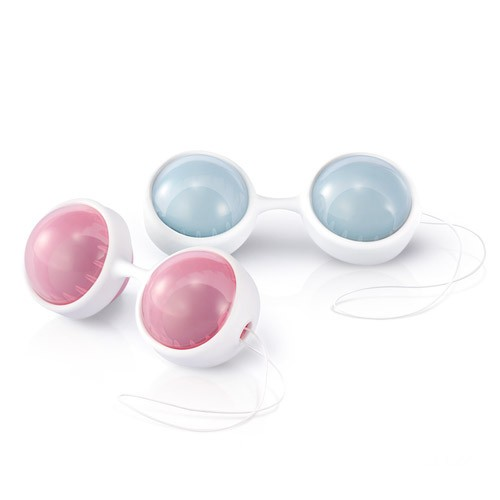 Set of four weighted kegel balls in pink and blue on a white background