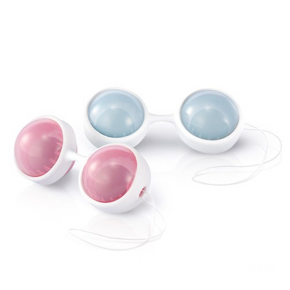 Set of four weighted kegel balls in pink and blue on a white background