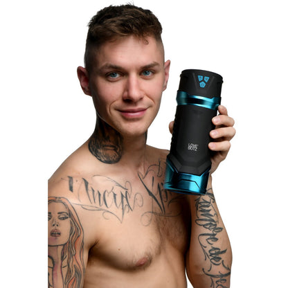 Man holding a black and blue device with tattoos on his arms against a white background