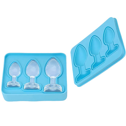 Blue silicone ice cube tray with unique anl plug shapes on a white background