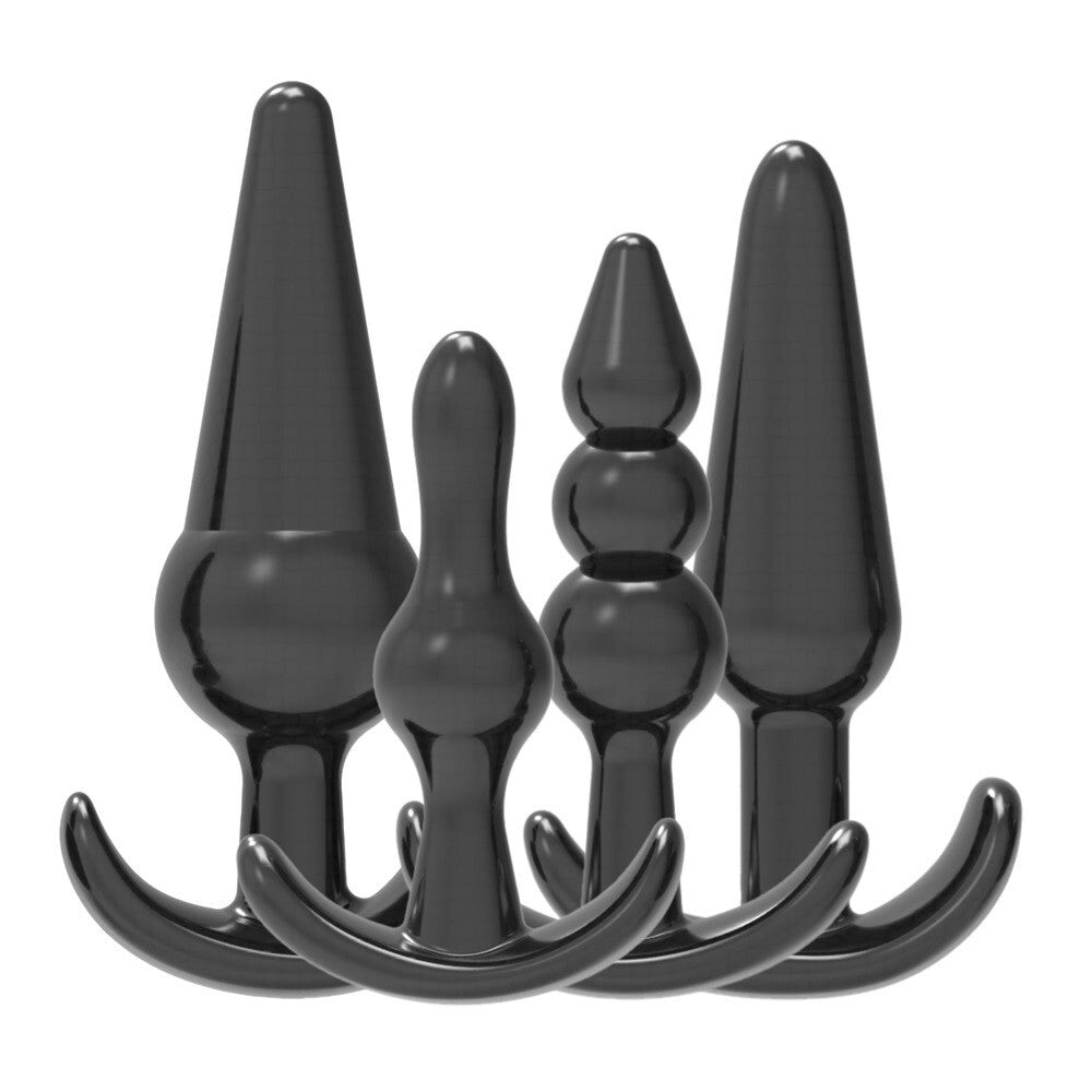 Set of black silicone butt plugs on a white background