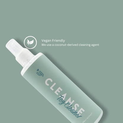 Bottle of CLEANSE toy cleaner with a coconut-derived cleaning agent label on a green background