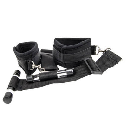 Black restraint set with cuffs, straps, and hooks on a white background