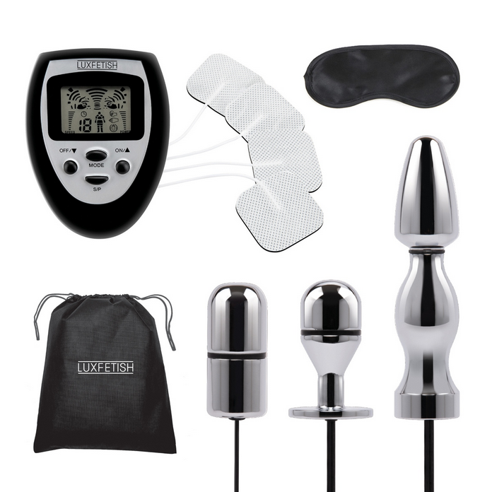 Collection of electronic devices and accessories with a digital display and various components on a white background.
