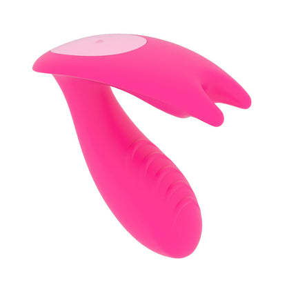 Pink handheld massage device on a white background