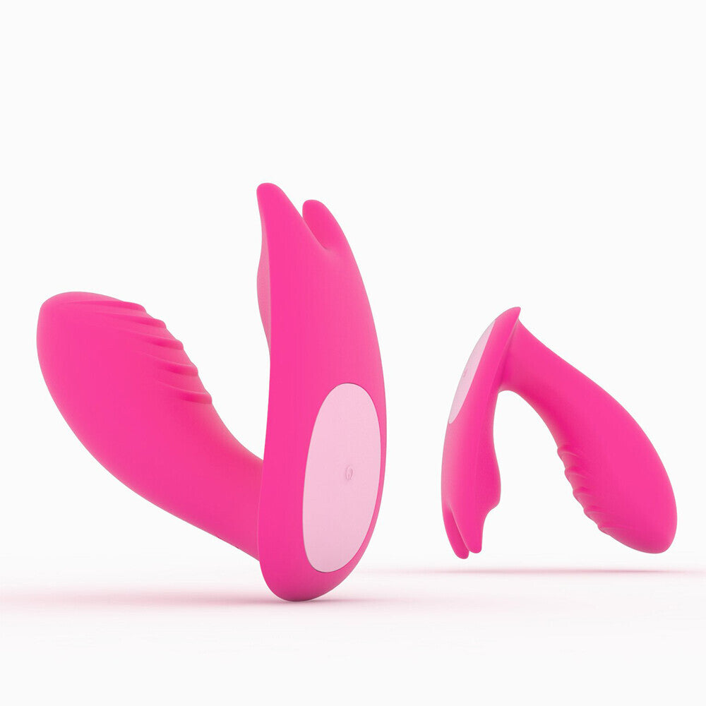 Pink and white vibrating massage adult device on a white background