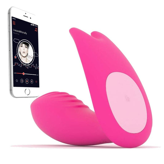Pink electronic massage device with smartphone displaying app interface on a white background