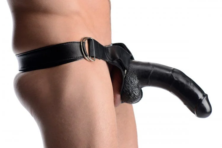 Black leather strap-on around a person's waist on a white background