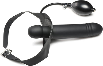 Black strap-on device with a hose and strap on a white background