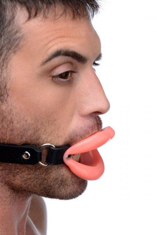 Man wearing a black muzzle with a pink silicone lips on a white background