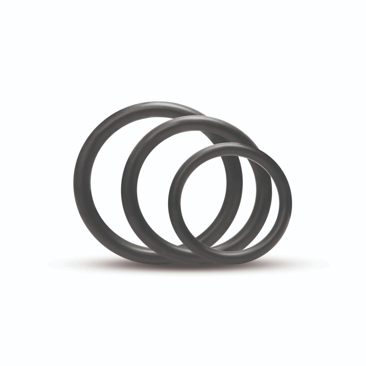 Three black rubber O-rings stacked on a white background