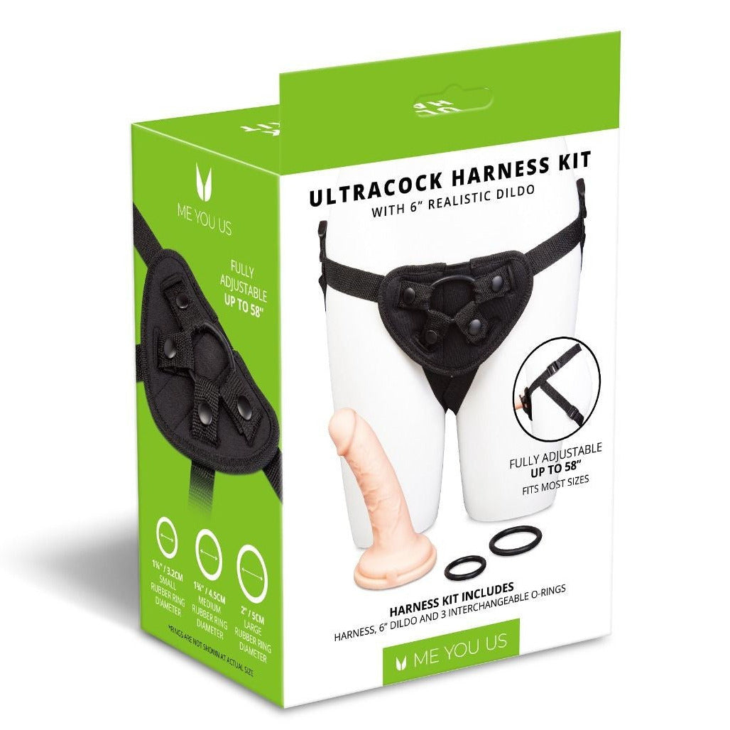 Box of Ultracock Harness Kit with realistic dildo on a white background