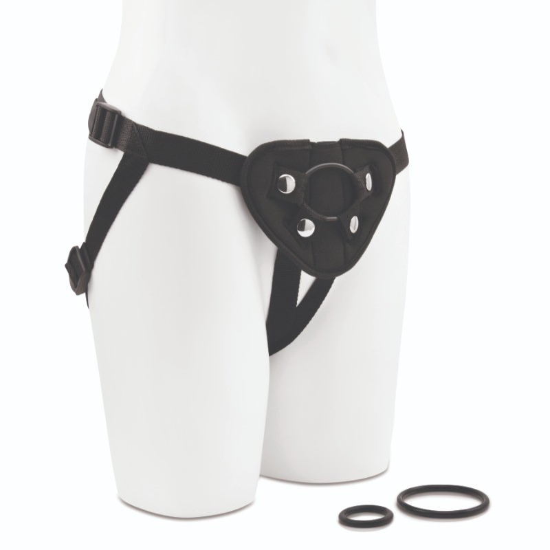 Black strap-on harness and rings on white body with a white background