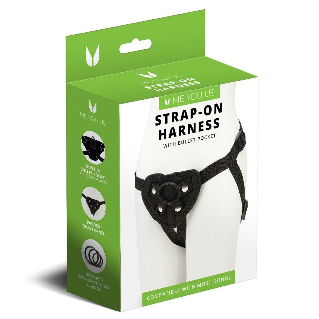 Packaged strap-on harness with green and white box on a white background
