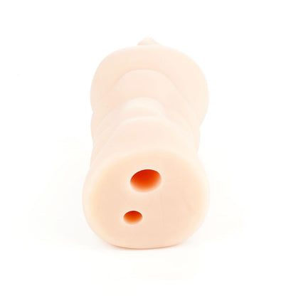 Small, light-colored object with two circular holes on a white background
