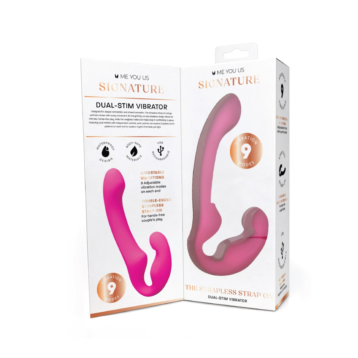 The Signature Dual-Stim Vibrator in pink, shown next to its retail packaging box. The box is white with rose gold accents and features a clear window displaying the pink curved strap vibrator inside.