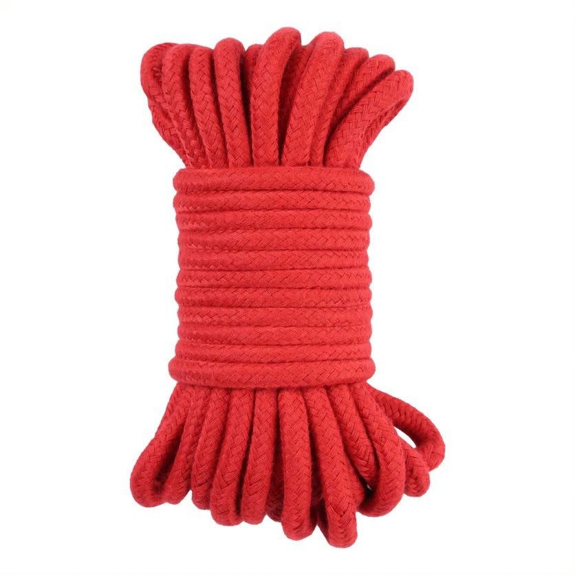 Red rope coiled on a white background