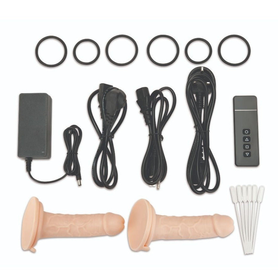 Collection of dildos and sex machine equipment parts on a white background
