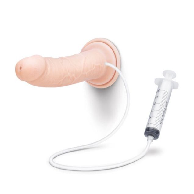 Dildo with a hose and syringe on a white background
