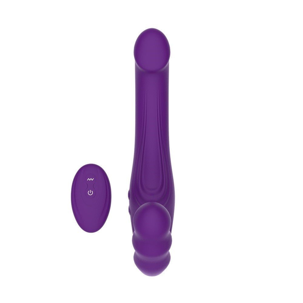 Purple electronic strapon with remote control on a white background
