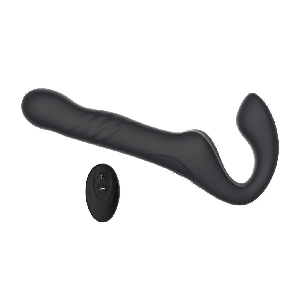 Black curved device with a remote control on a white background