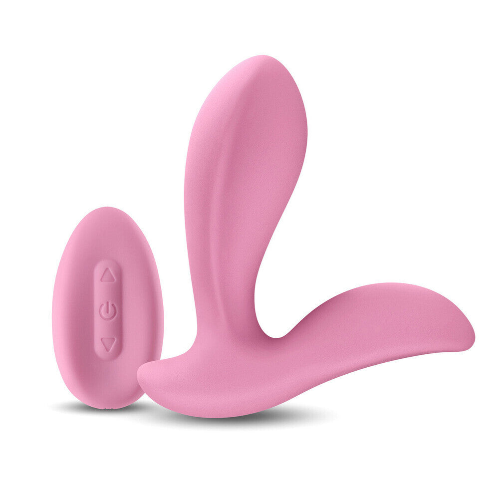Pink silicone clitoral g-spot vibrator on a white background