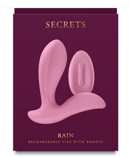 Pink rechargeable vibe with remote on a purple packaging box labeled 'Secrets Rain'.