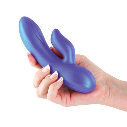 Hand holding a blue rabbit-shaped massager against a white background
