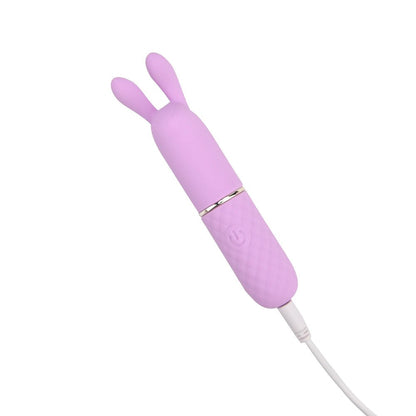 Pink rabbit-shaped electronic device on a white background
