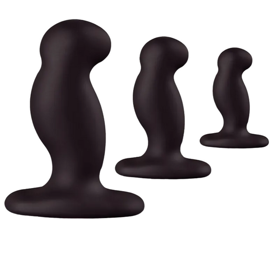 Three black silicone butt plugs of different sizes on a white background
