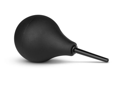 Black bulb syringe on a white background