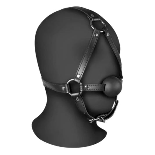 Black leather head harness on a mannequin head with a white background