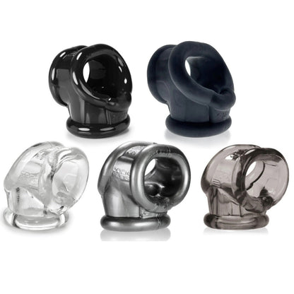 Set of black, clear, and gray cockrings on a white background