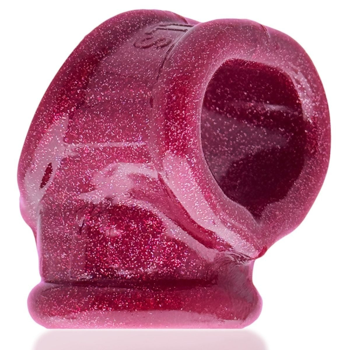 Pink silicone ring with speckled texture on a white background