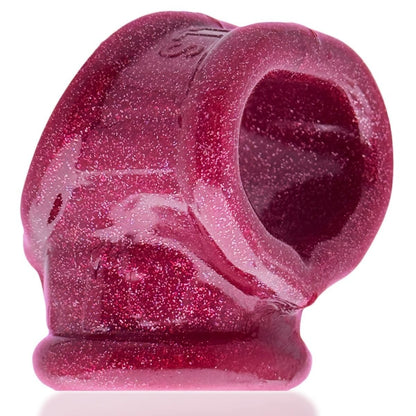 Pink silicone ring with speckled texture on a white background