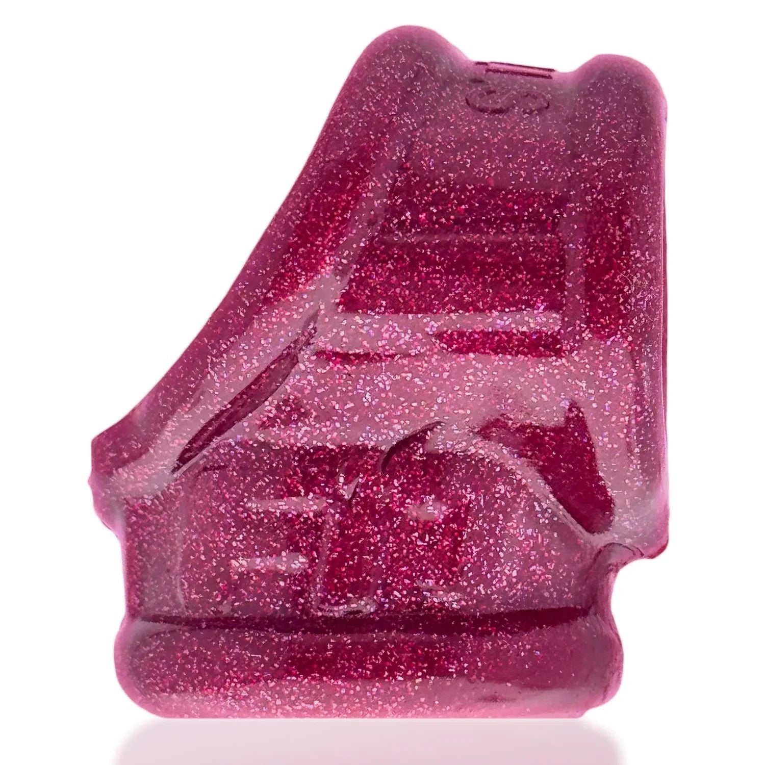 Pink glittery object on a white background